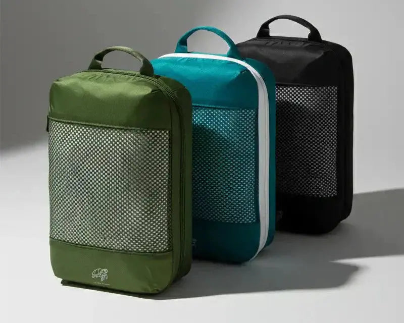 Packing cubes in different colours in a studio background