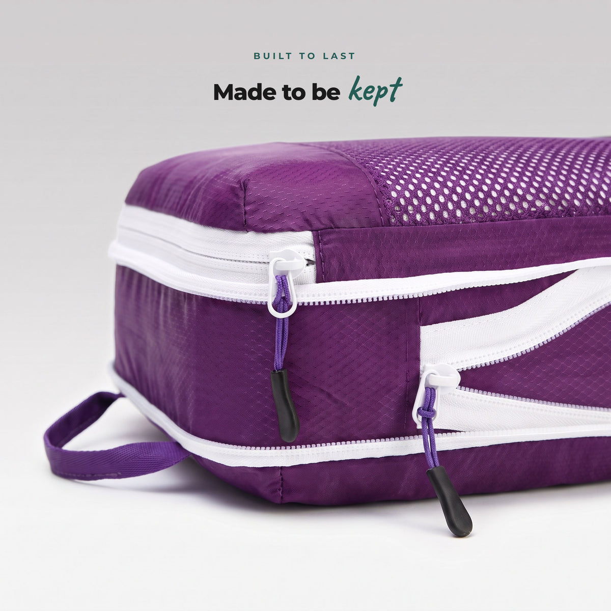 Close-up of Violet Reef Cube Packer packing cube zip and pull cord, durable ripstop fabric built to last