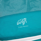Close up of Cube Packer compression packing cube in teal showing mesh fabric and logo detail