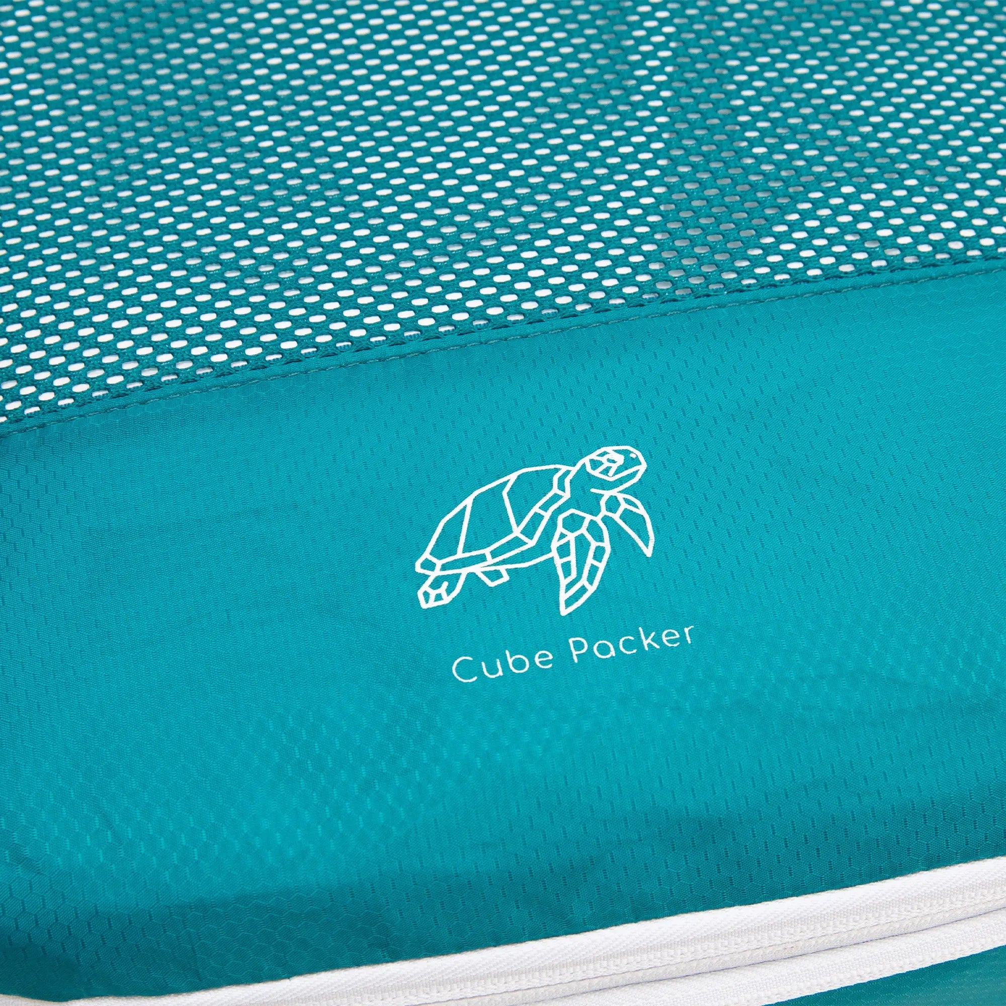 Close up of Cube Packer compression packing cube in teal showing mesh fabric and logo detail