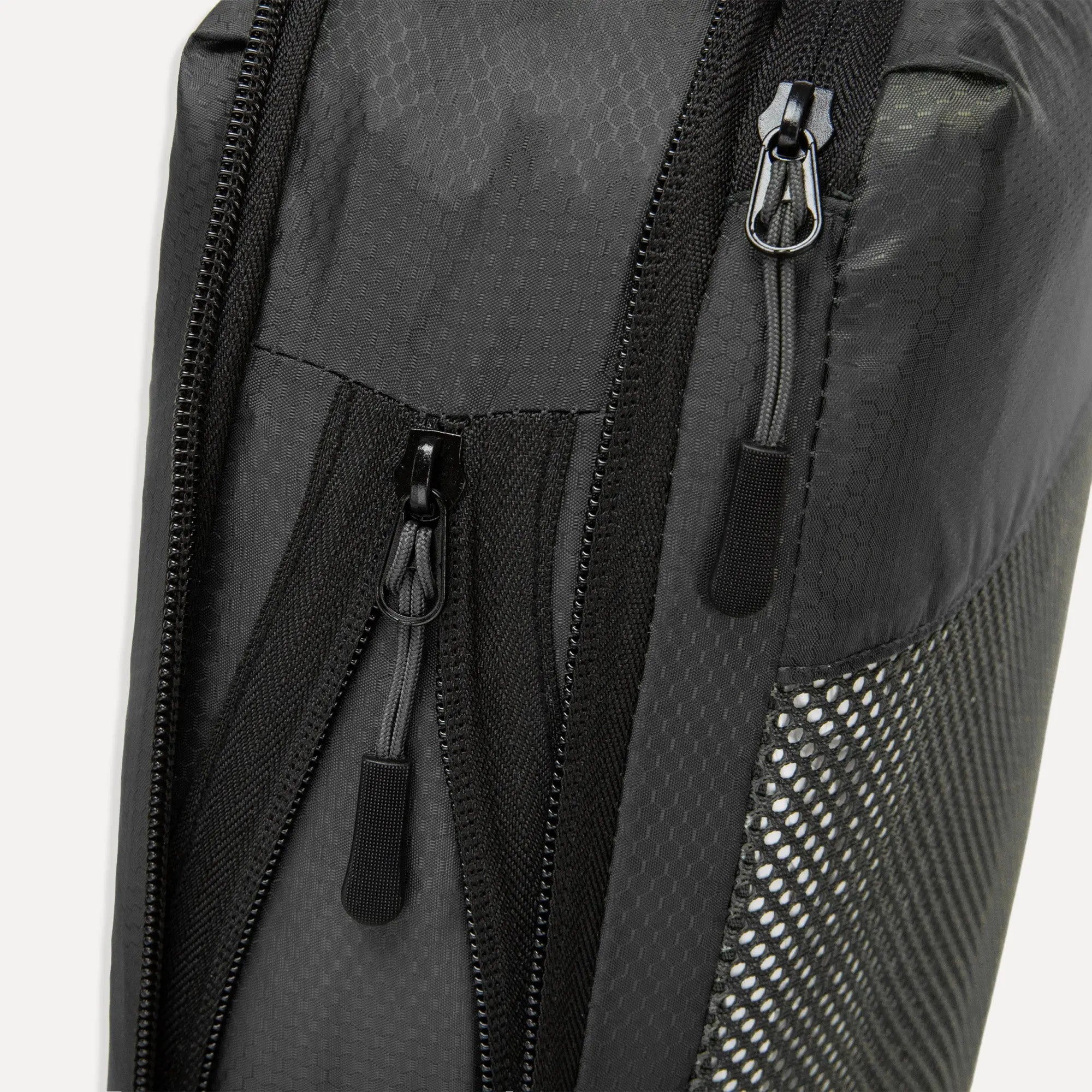 Close up of Cube Packer compression packing cube zip in black showing durable fastening detail