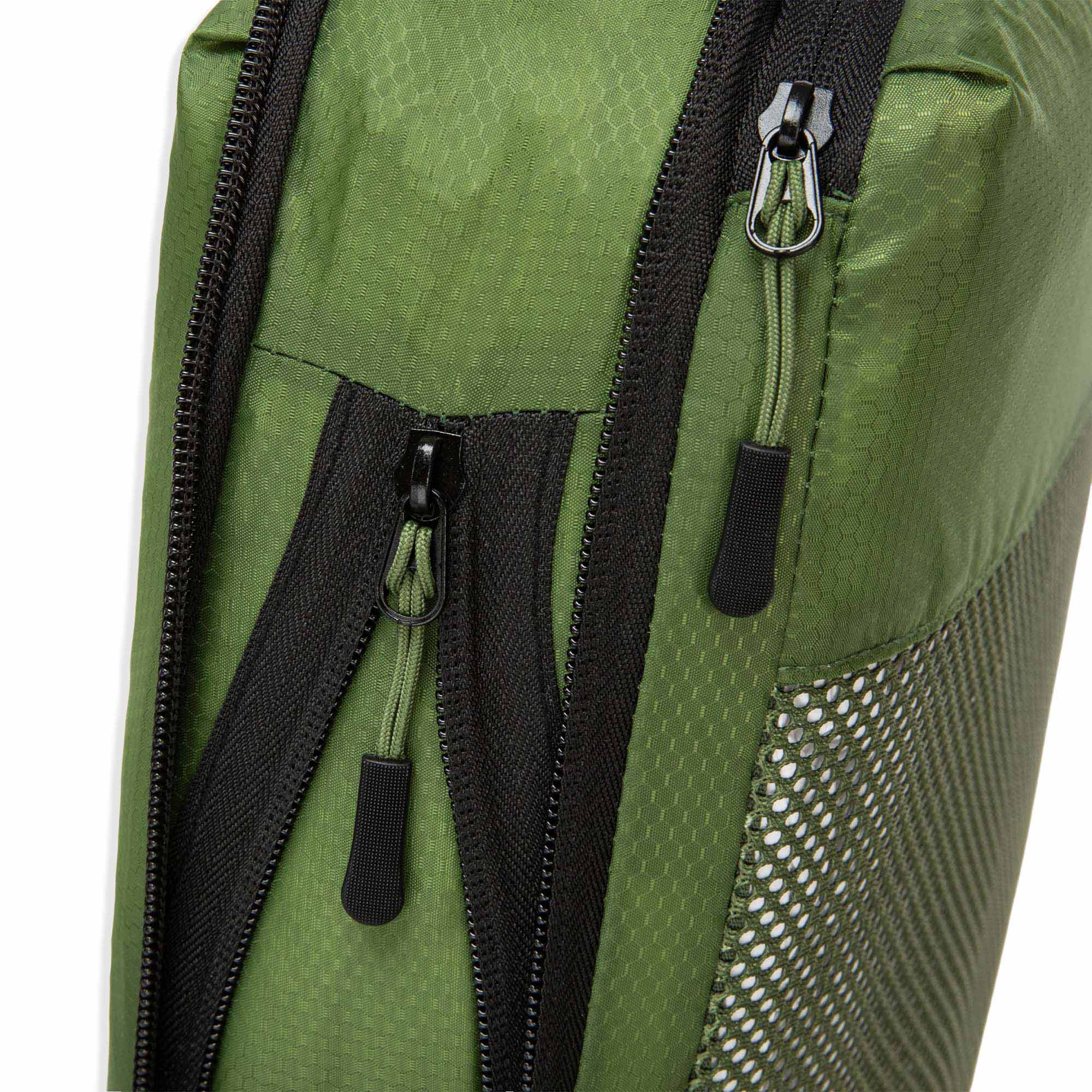 Close up of Cube Packer compression packing cube zip in green showing durable fastening detail