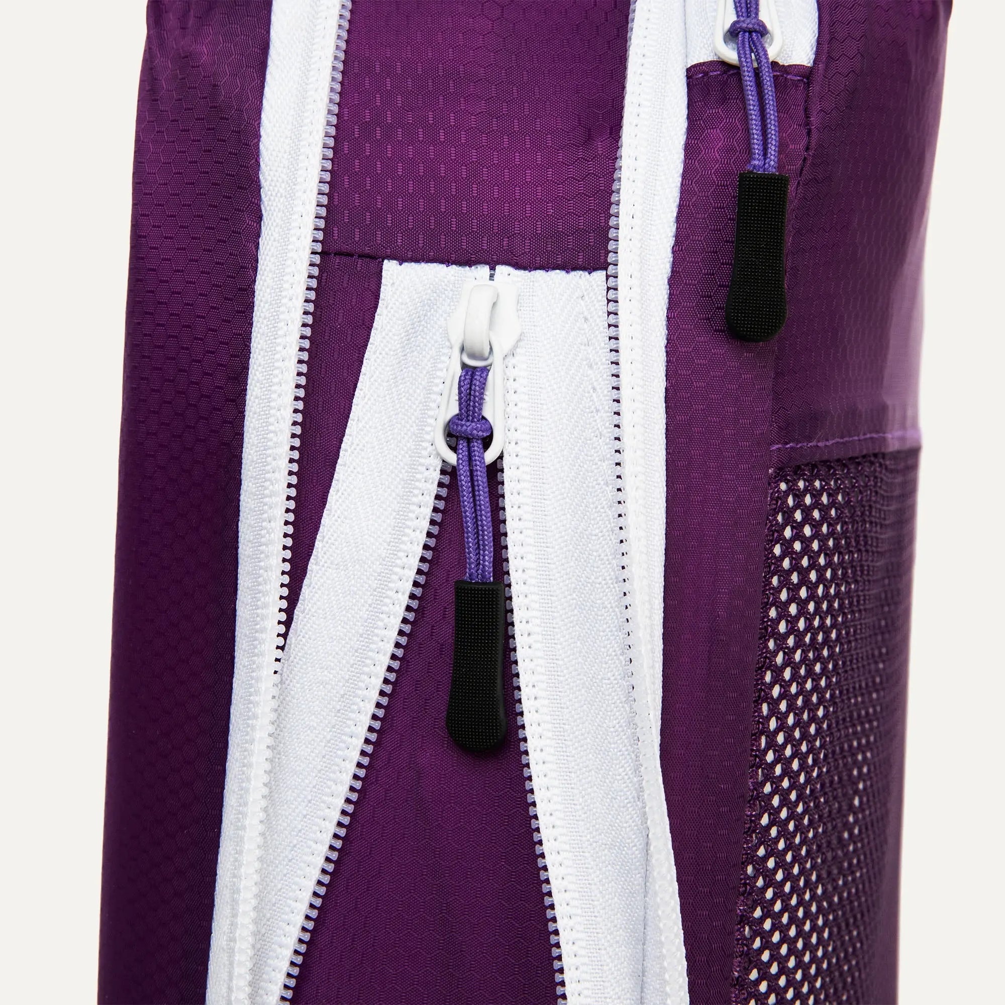 Close up of Cube Packer compression packing cube zip in purple showing durable fastening detail