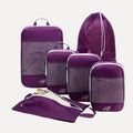 Cube Packer Essential Bundle with compression packing cubes, shoe bag and laundry bag in purple on a white background