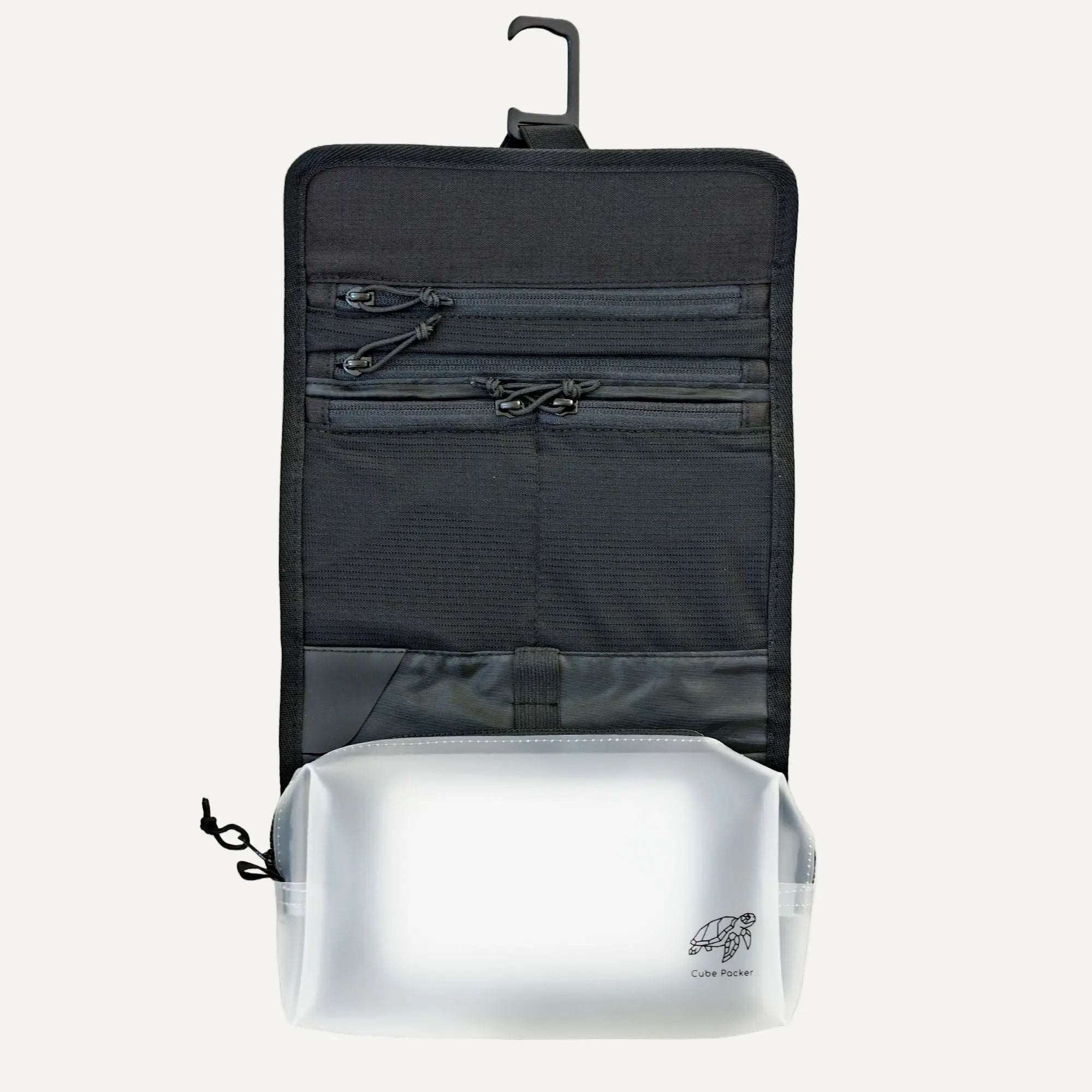 Open Cube Packer toiletries bag in black showing internal compartments for organised travel toiletries