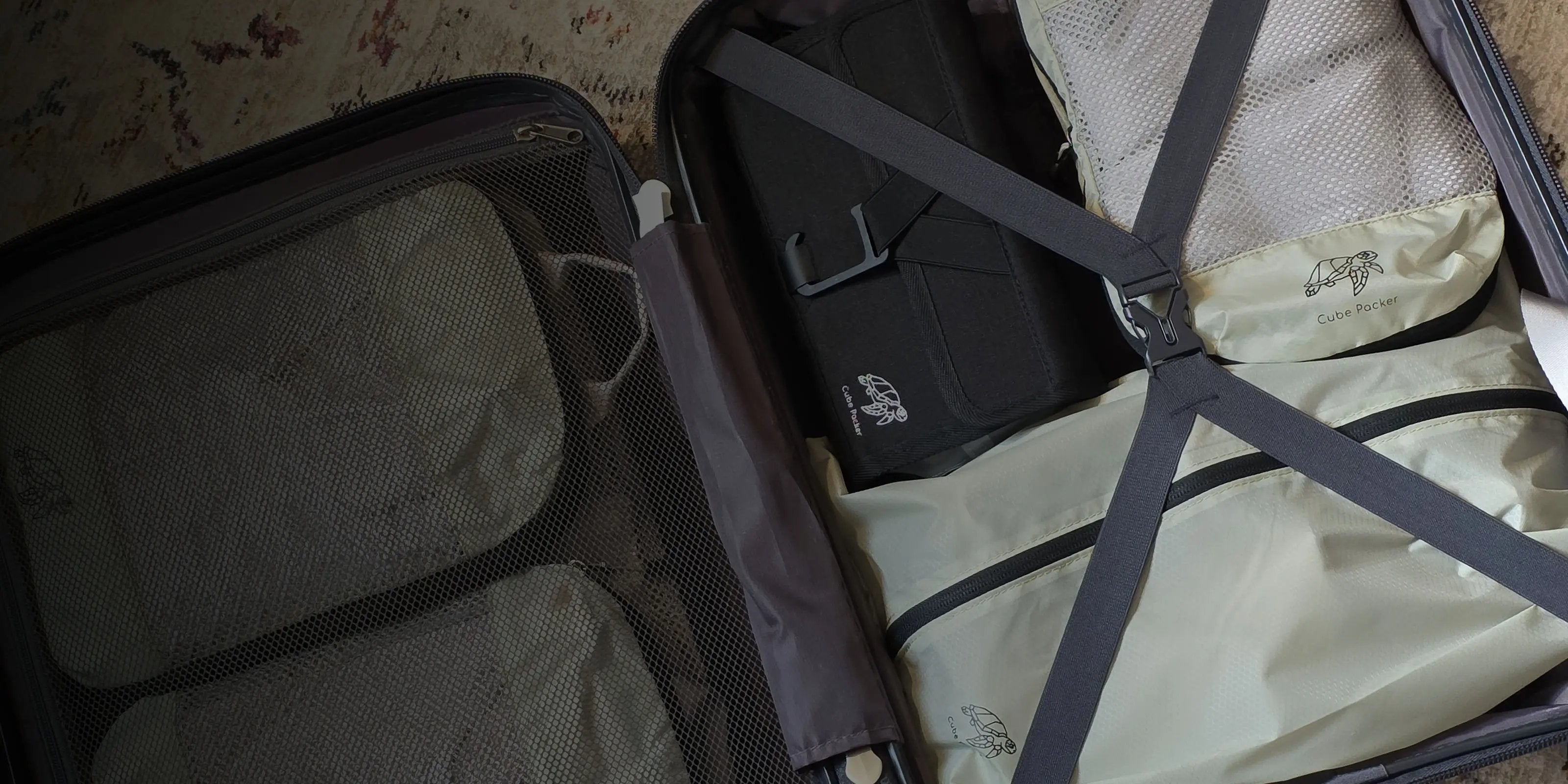 Open suitcase neatly packed with Cube Packer packing cubes and travel organisers