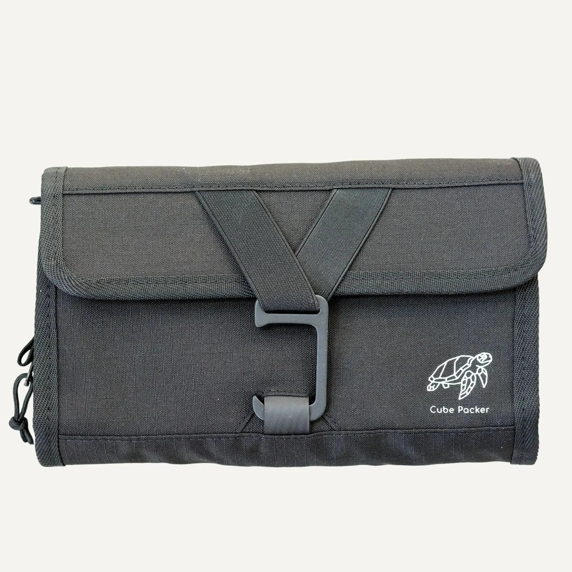Closed Cube Packer roll-up  toiletries bag in black designed for compact and organised travel storage