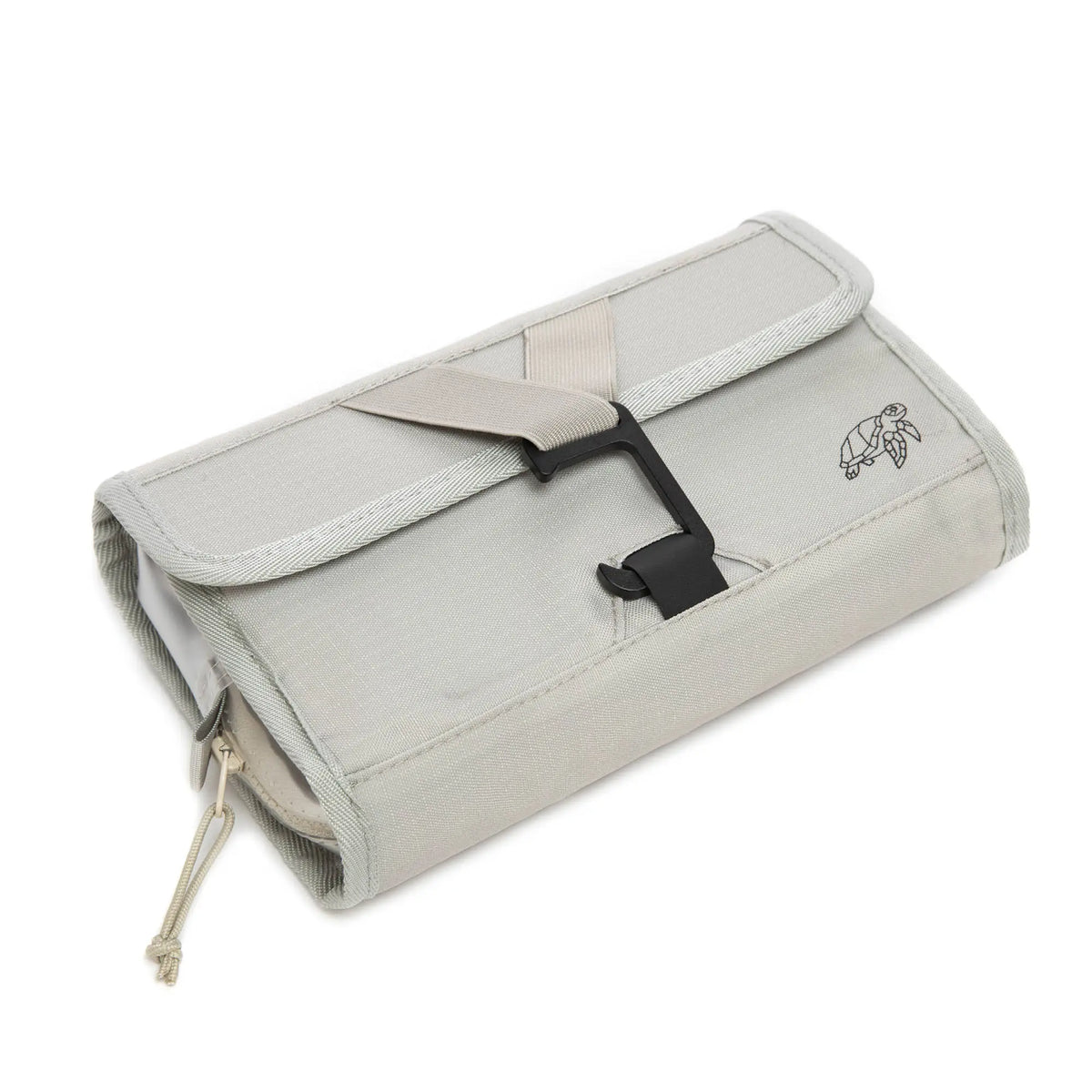 Sand roll-up wash bag folded flat and strapped, viewed from above at an angle