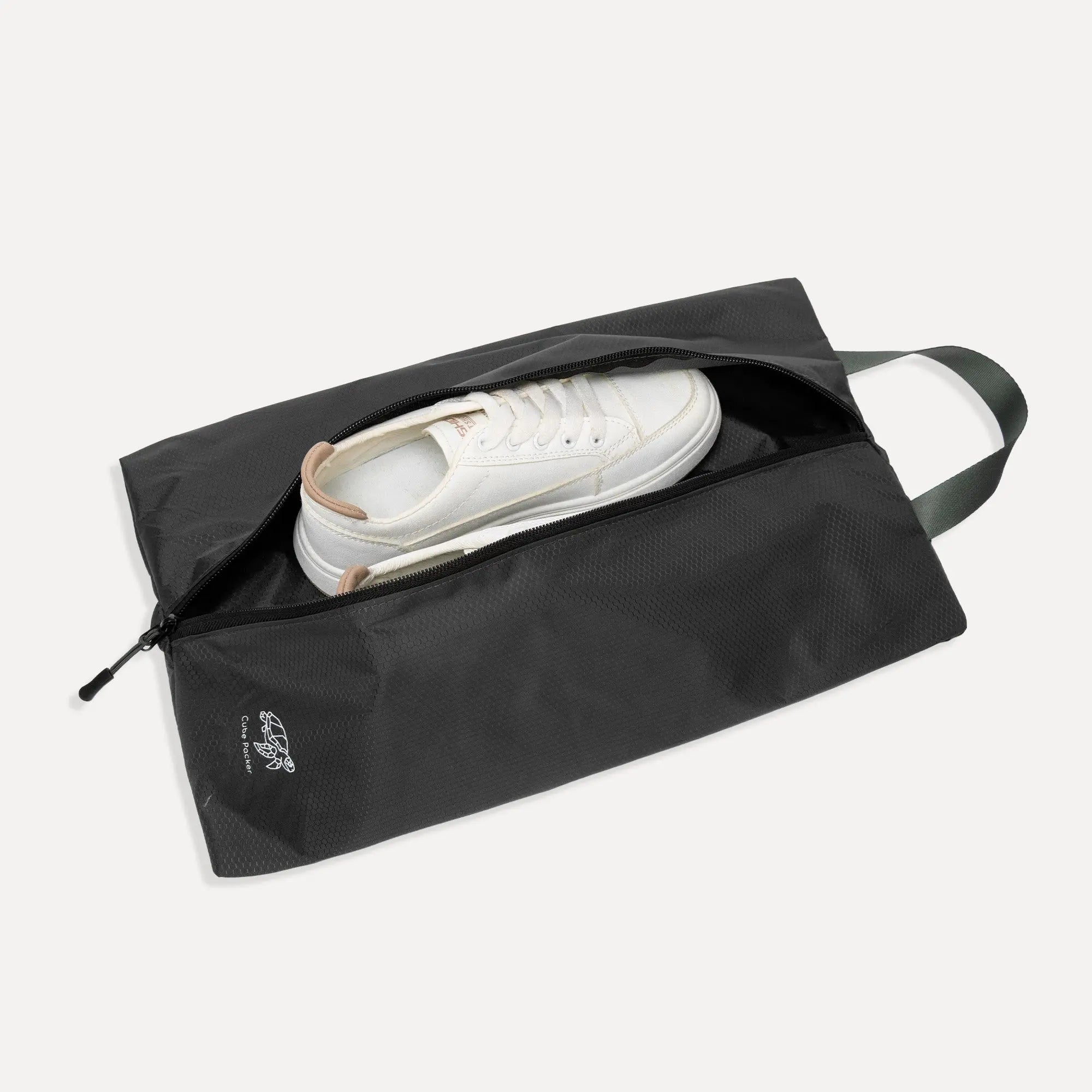 Open Cube Packer shoe bag in black showing interior space for travel footwear