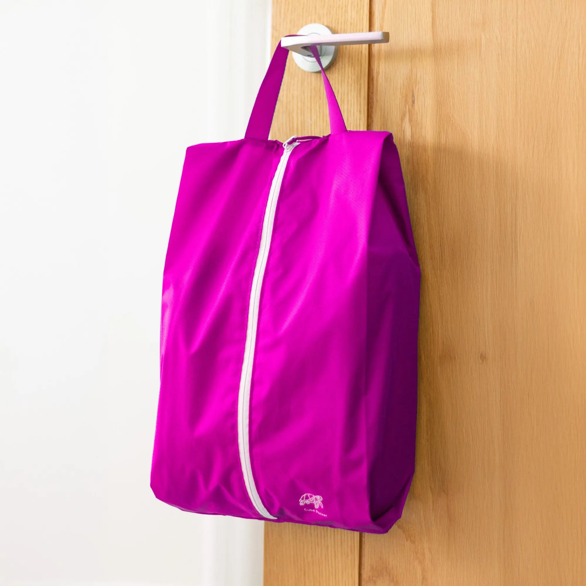 Cube Packer shoe bag in pink for clean and organised travel storage