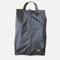 Cube Packer shoe bag in black standing upright for clean and organised travel storage