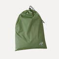 Cube Packer travel laundry bag in green  with drawstring closure for separating clothes while travelling
