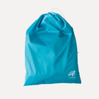 Cube Packer travel laundry bag in teal with drawstring closure for separating clothes while travelling
