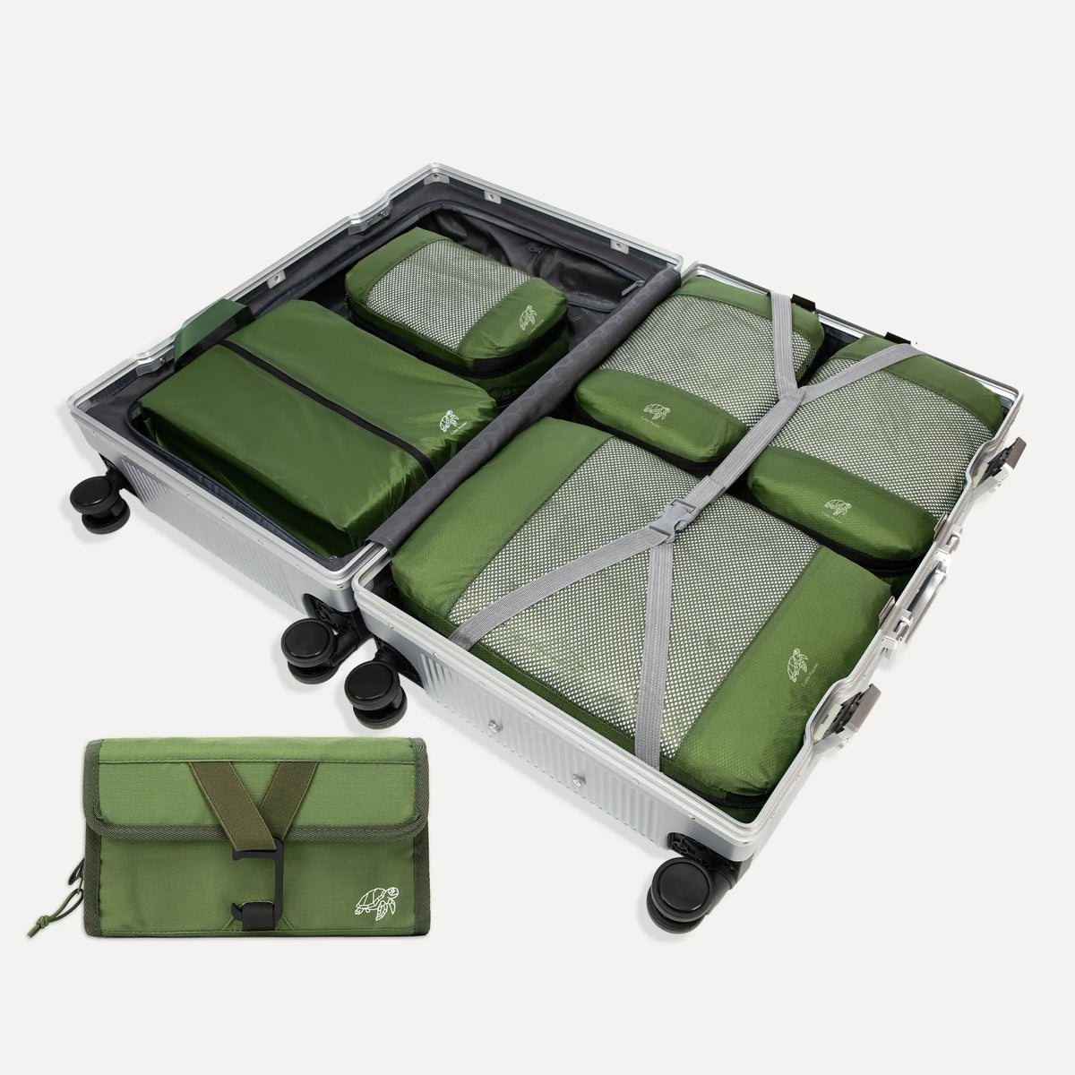 Cube Packer Travel System Bundle in Green including compression packing cubes, shoe bag, laundry bag and toiletries bag arranged in front of a suitcase