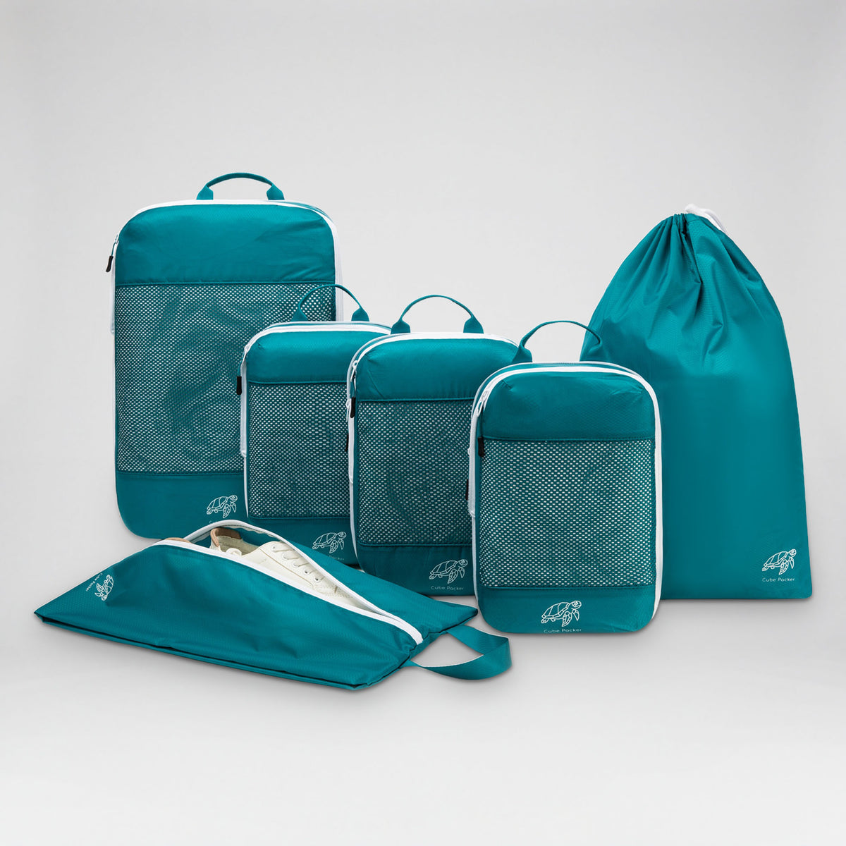 Cube Packer Essential Packing Bundle in Reef Teal: four compression packing cubes, laundry bag and shoe bag