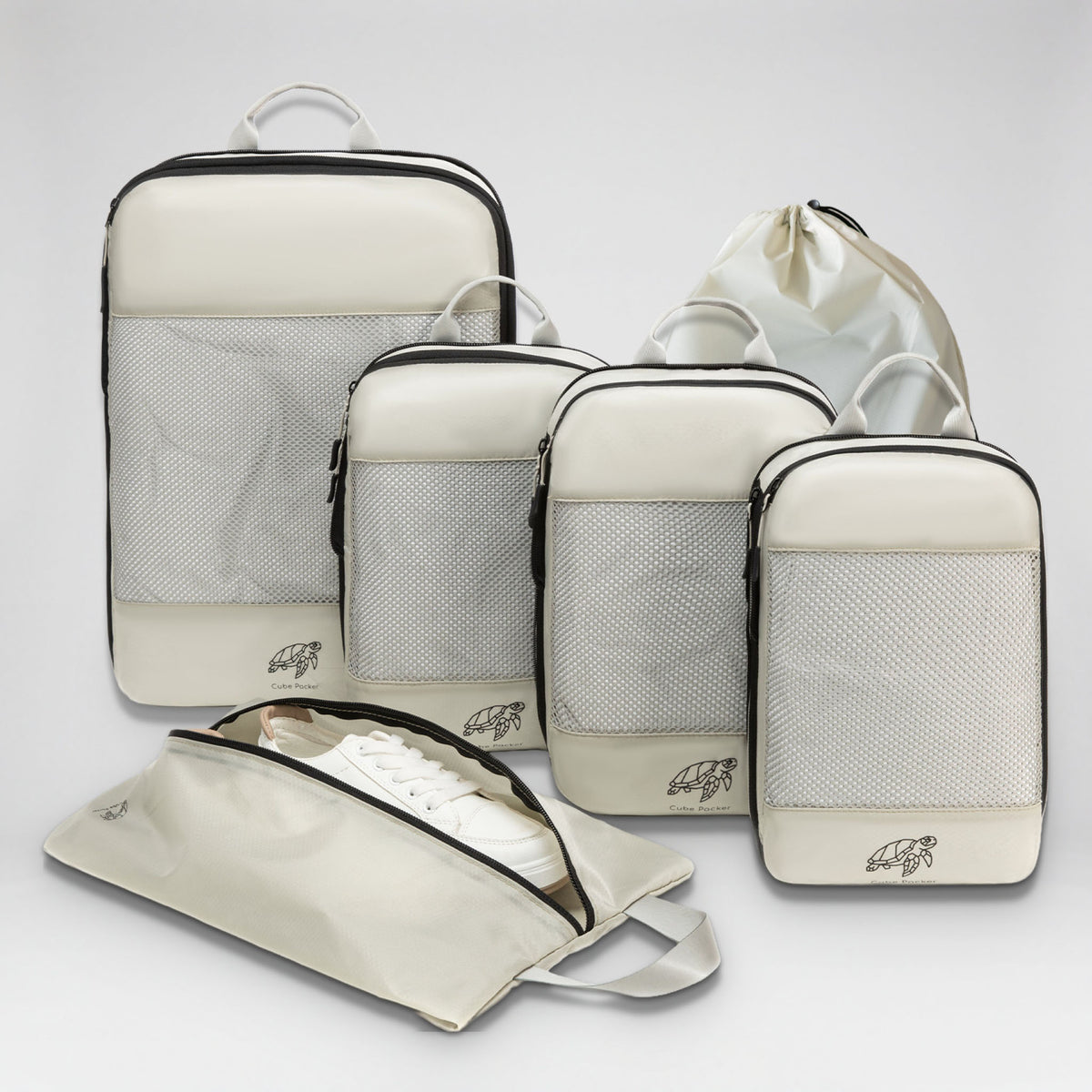Cube Packer Essential Packing Bundle in Sand: four compression packing cubes, laundry bag and shoe bag
