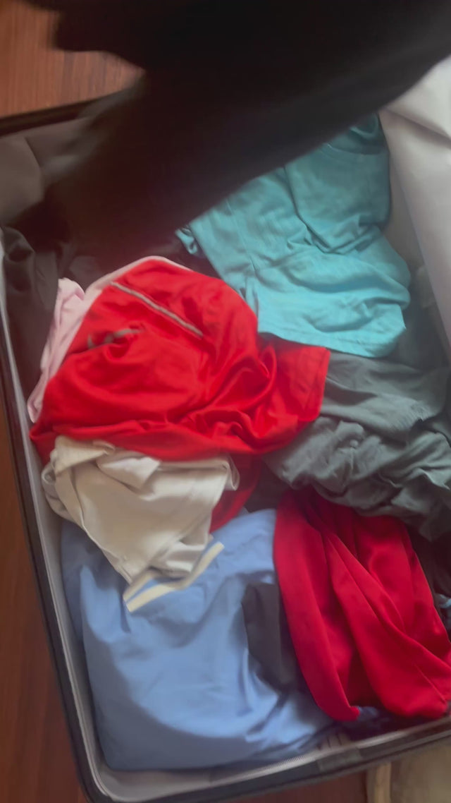Cube Packer Travel System Bundle being packed in a suitcase